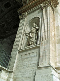 Low angle view of statue against temple