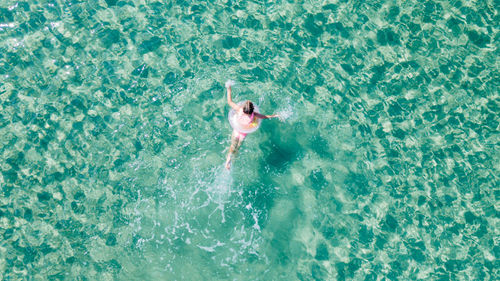 High angle view of person swimming in sea