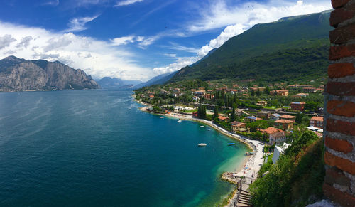 Panoramic view of sea and buildings against sky