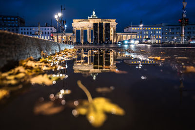 Reflection of illuminated buildings in water at night