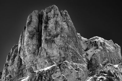 Low angle view of rock formation against sky
