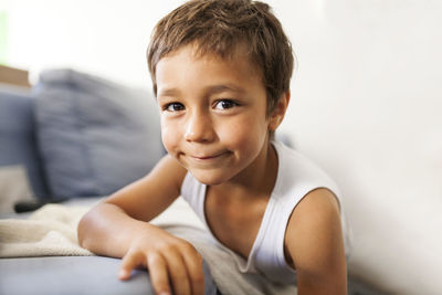 Portrait of smiling little boy wearing vest