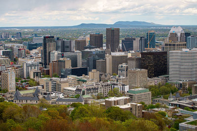 High angle view of buildings in city against sky