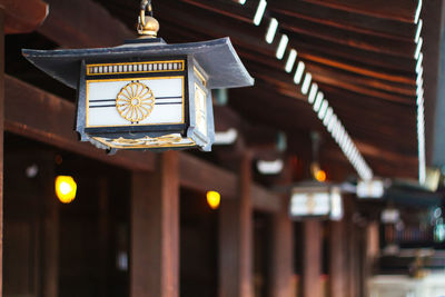 Low angle view of illuminated clock