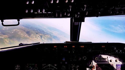 Landscape shot through airplane cockpit