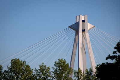 Low angle view of bridge against clear blue sky