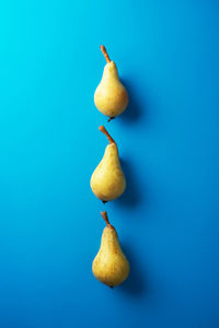 Close-up of apple against blue background