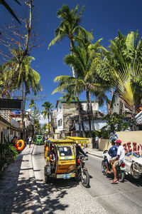 Vehicles on road against sky