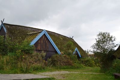 House on field against sky
