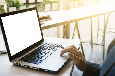 Man using laptop on table