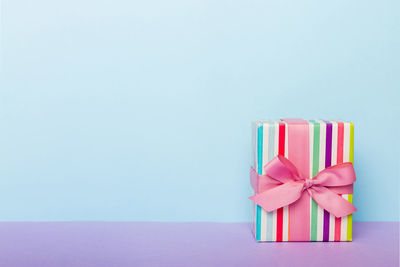 Close-up of gift against blue background