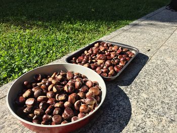 High angle view of chestnuts drying bowls on tiled walkway