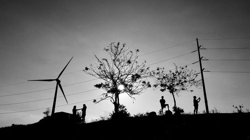 Low angle view of electricity pylon against sky