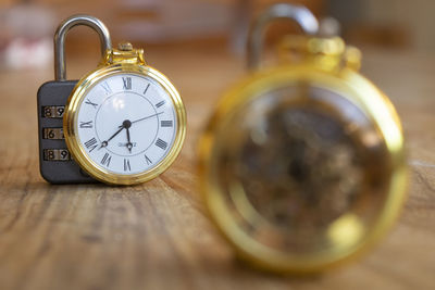 Close-up of pocket watch on table