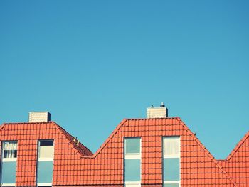 Low angle view of building against blue sky