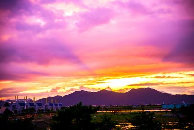 Scenic view of mountains against cloudy sky