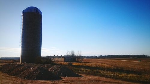 View of landscape against clear blue sky