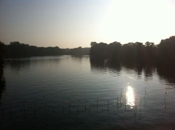 Scenic view of lake at sunset