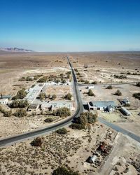 High angle view of vehicles on road against clear sky