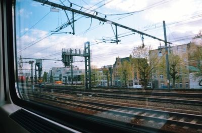 Railroad tracks seen through train windshield