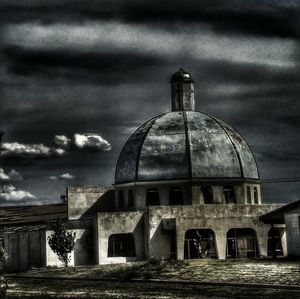 Built structure against cloudy sky