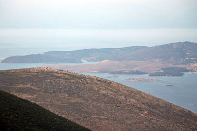 Scenic view of landscape and mountains against sky