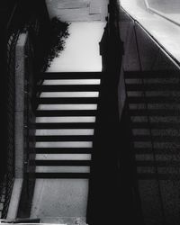 Shadow of woman on staircase