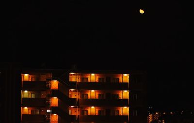 Low angle view of illuminated building at night