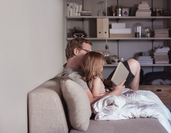 Father reading story to daughter