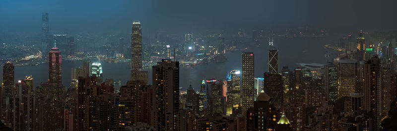 Aerial view of city lit up at night