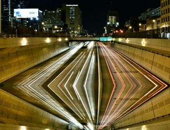 Road passing through city at night