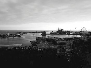 High angle view of harbor by sea against sky