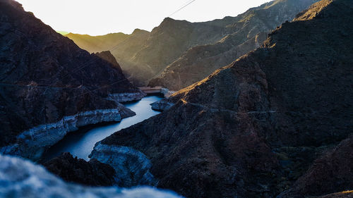 Aerial view of mountain range against sky