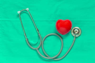 High angle view of heart shape on blue table