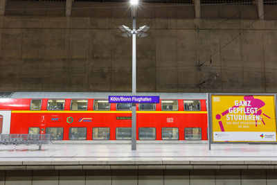 Information sign on illuminated wall in city