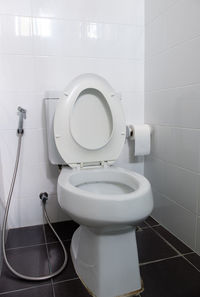 The clean water closet in the bathroom of the urban house, clean and hygienic after cleaning.
