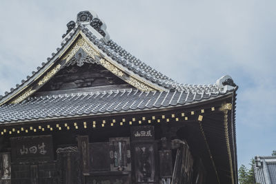 Low angle view of temple building against sky