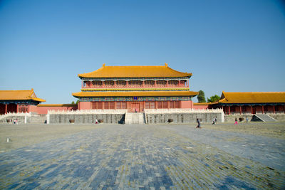 View of temple against clear blue sky