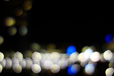 Defocused image of illuminated lights at night