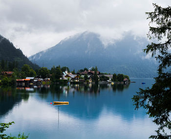 Scenic view of lake and mountains against sky