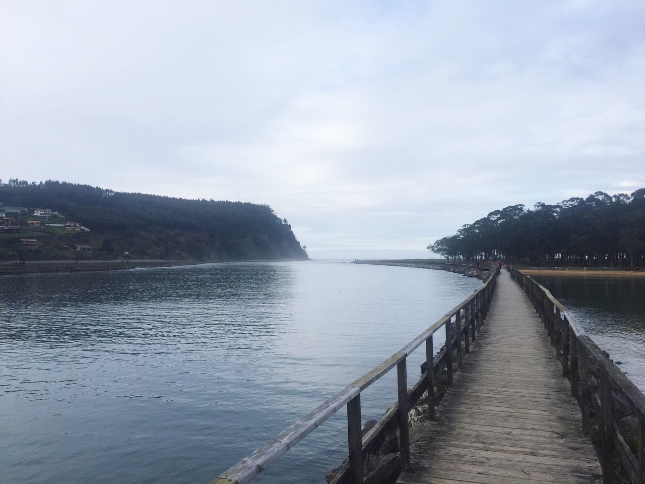 water, sky, tranquil scene, tranquility, scenics, mountain, lake, beauty in nature, nature, the way forward, cloud - sky, railing, river, built structure, pier, day, idyllic, non-urban scene, outdoors, cloud