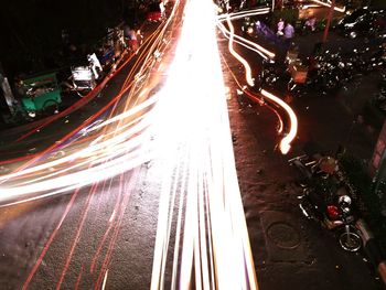 High angle view of illuminated railroad tracks at night