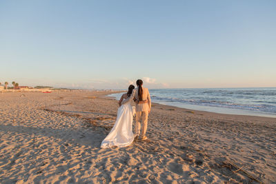 Couple walking on beach