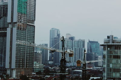 Low angle view of cityscape against clear sky