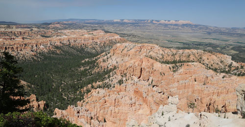 Aerial view of landscape with mountain range in background