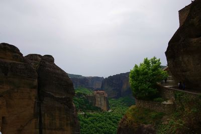 Rock formations on landscape against sky