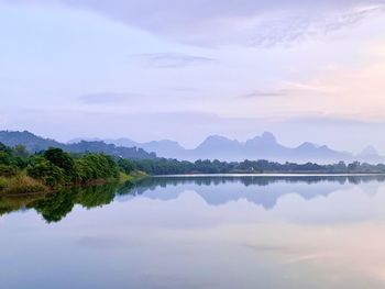 Scenic view of lake against sky during sunset