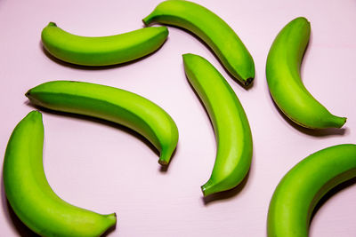 High angle view of green chili peppers on table