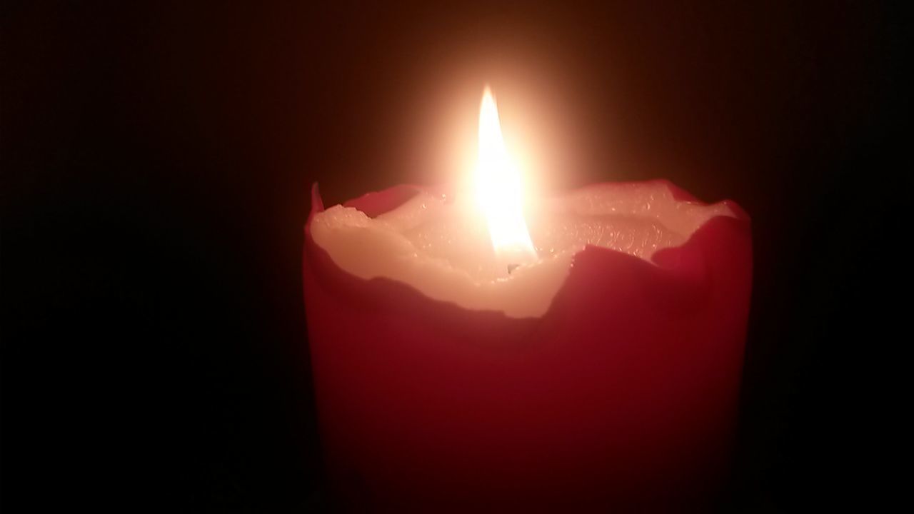 indoors, flame, black background, red, burning, studio shot, dark, candle, glowing, close-up, copy space, pink color, illuminated, night, fire - natural phenomenon, darkroom, lit, no people, heat - temperature, light - natural phenomenon