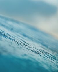 Close-up of blue sea against sky